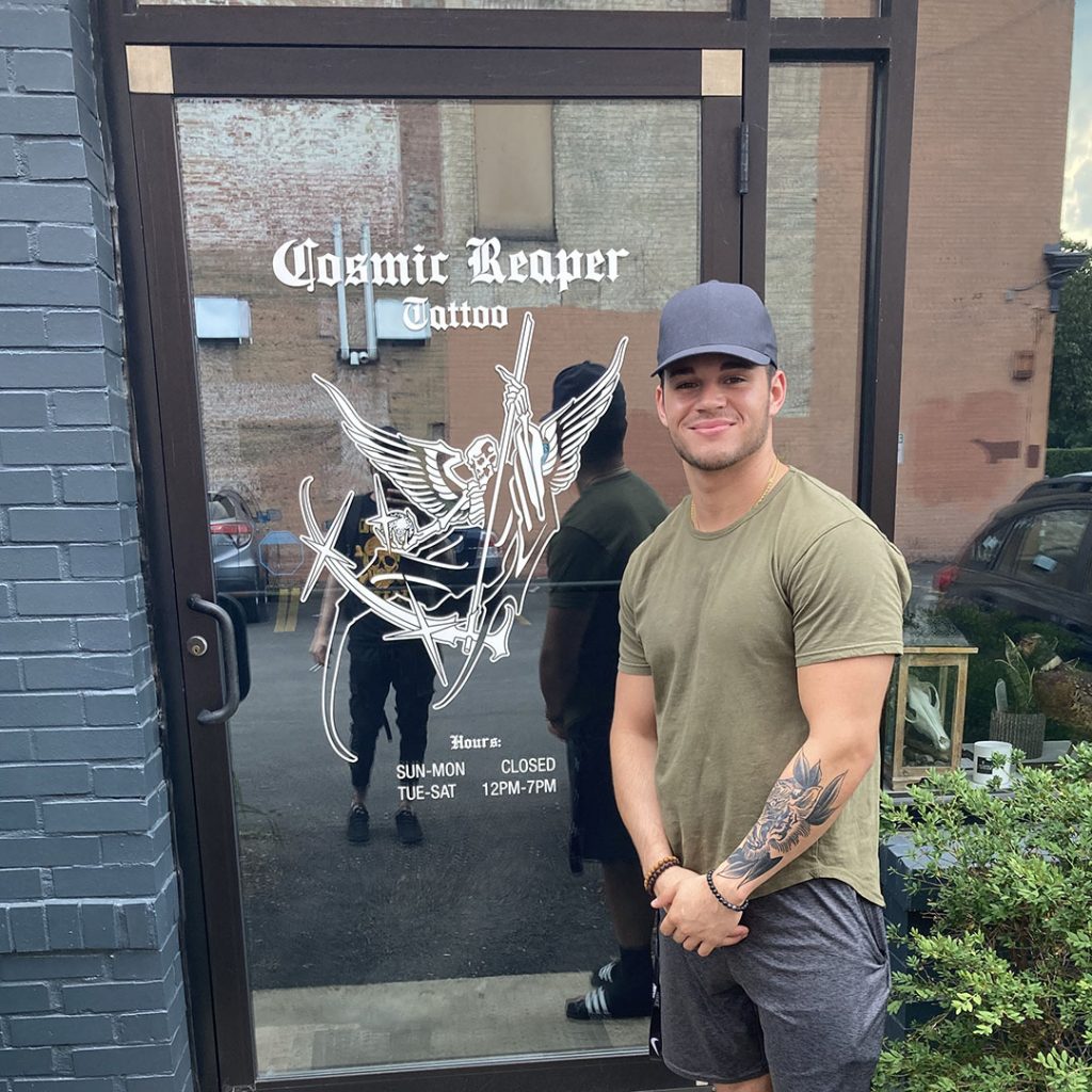 Johnny standing outside the front door of Cosmic Reaper Tattoo